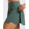 imageCRZ YOGA Tennis Skirts for Women High Waisted Side Slit Running Workout Athletic Mini A Line Skort with PocketsDark Forest Green