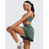 imageCRZ YOGA Tennis Skirts for Women High Waisted Side Slit Running Workout Athletic Mini A Line Skort with PocketsDark Forest Green
