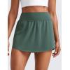 imageCRZ YOGA Tennis Skirts for Women High Waisted Side Slit Running Workout Athletic Mini A Line Skort with PocketsDark Forest Green