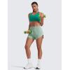imageCRZ YOGA High Waisted Dolphin Shorts for Women 3 for Running Athletic Workout Gym with Zipper Pockets LinerGreen Palm Court
