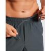 imageCRZ YOGA Casual Workout Mens Shorts 7 Inch Lightweight Quick Dry for Gym Athletic with Zipper PocketMelanite