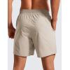 imageCRZ YOGA Casual Workout Mens Shorts 7 Inch Lightweight Quick Dry for Gym Athletic with Zipper PocketMojave Tan