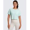 imageCRZ YOGA Open Back Short Sleeve Crop Top for Women Loose Athletic Yoga Workout Shirts Casual Cropped TShirtsSkylight Green