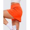 imageCRZ YOGA Womens High Waisted Tennis Skirts with 3 Pockets Golf A Line Lightweight Cute Athletic Casual SkortsNeon Orange