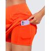 imageCRZ YOGA Womens High Waisted Tennis Skirts with 3 Pockets Golf A Line Lightweight Cute Athletic Casual SkortsNeon Orange
