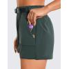 imageCRZ YOGA Womens Waterproof Stretch Hiking Shorts Mid Rise Summer for Outdoor Golf Workout with Zip Pockets Belt  3Evergreen