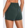 imageCRZ YOGA Womens Waterproof Stretch Hiking Shorts Mid Rise Summer for Outdoor Golf Workout with Zip Pockets Belt  3Evergreen