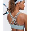 imageCRZ YOGA Womens Strappy Sports Bras Fitness Workout Padded Yoga Top Criss Cross Back CamiCambric Blue