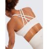imageCRZ YOGA Womens Strappy Sports Bras Fitness Workout Padded Yoga Top Criss Cross Back CamiMilky White Bone