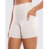imageCRZ YOGA Womens Naked Feeling Biker Shorts with Pockets 5  High Waisted Yoga Gym Workout SpandexMilky White
