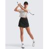 imageCRZ YOGA Dolphin Golf Skirts for Women A Line High Waisted Casual Athletic Mini Tennis Pickleball Skort with Zipper PocketBlack