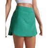 imageCRZ YOGA Dolphin Golf Skirts for Women A Line High Waisted Casual Athletic Mini Tennis Pickleball Skort with Zipper PocketCascadia Green