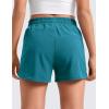 imageCRZ YOGA Girls Athletic Shorts with Zipper Pocket for Teens Kids Running Workout Casual Tennis Soccer Lightweight LinerBorealis Green