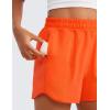 imageCRZ YOGA Girls Athletic Shorts with Zipper Pocket for Teens Kids Running Workout Casual Tennis Soccer Lightweight LinerNeon Orange