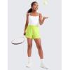 imageCRZ YOGA Girls Athletic Shorts with Zipper Pocket for Teens Kids Running Workout Casual Tennis Soccer Lightweight LinerNeon Yellow