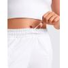 imageCRZ YOGA Girls Athletic Shorts with Zipper Pocket for Teens Kids Running Workout Casual Tennis Soccer Lightweight LinerWhite