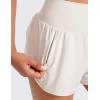 imageCRZ YOGA High Waisted Running Shorts for Women Ruffled Trim Tummy Control for Athletic with Mesh Liner Zip PocketMilky White Bone