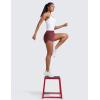 imageCRZ YOGA High Waisted Dolphin Shorts for Women 3quot for Running Athletic Workout Gym with Zipper Pockets LinerRed Merlot