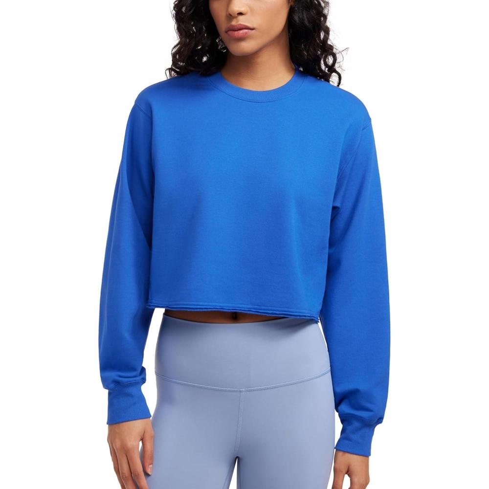 imageCRZ YOGA Womens Fleece Cropped Sweatshirts Crewneck Long Sleeve Double Raw Hem Workout Casual Pullover TopsSparkle Blue