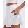 imageCRZ YOGA Womens Mini Pleated Athletic Tennis Skirts High Waisted A Line Golf Pickleball Casual Skort with Inner PocketsWhite