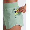 imageCRZ YOGA Mid Waisted Running Shorts for Women 3quot Curved Hems for Athletic Workout Gym with Zipper Pockets LineGreen Palm Court