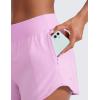 imageCRZ YOGA Mid Waisted Running Shorts for Women 3quot Curved Hems for Athletic Workout Gym with Zipper Pockets LineVita Pink