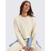 imageCRZ YOGA Womens Fleece Cropped Sweatshirts Crewneck Long Sleeve Sweat Shirts Double Raw Hem Workout Casual Pullover TopsWhite Apricot