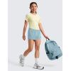 imageCRZ YOGA Girls 2 in 1 Dolphin Athletic Running Shorts with Pockets High Waist Teen Kid Workout Casual Tennis Soccer SplitLight Grayish Blue