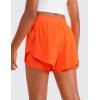 imageCRZ YOGA Girls 2 in 1 Dolphin Athletic Running Shorts with Pockets High Waist Teen Kid Workout Casual Tennis Soccer SplitNeon Orange