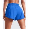 imageCRZ YOGA High Waisted Dolphin Running Shorts for Womens Mesh Liner Gym Workout Athletic Shorts with Zipper PocketSparkle Blue