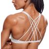 imageCRZ YOGA Womens Strappy Sports Bra  Criss Cross Back Padded Medium Support Wireless Gym Bra Sexy Workout Yoga BraMilky White