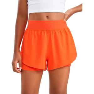 imageCRZ YOGA Girls 2 in 1 Dolphin Athletic Running Shorts with Pockets High Waist Teen Kid Workout Casual Tennis Soccer SplitNeon Orange