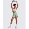 imageCRZ YOGA High Waisted Dolphin Athletic Running Shorts for Women 3quot High Split Comfy Mesh Liner for Gym Workout TrackGreen Palm Court