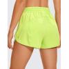 imageCRZ YOGA Womens High Waisted Running Shorts Mesh Liner 3 Dolphin Quick Dry for Athletic Gym Track Workout with Zip PocketNeon Yellow