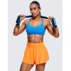 imageCRZ YOGA Womens Strappy Sports Bra  Criss Cross Back Padded Medium Support Wireless Gym Cami Workout YogaMadagascar Blue