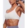imageCRZ YOGA Womens Strappy Sports Bra  Criss Cross Back Padded Medium Support Wireless Gym Cami Workout YogaMilky White