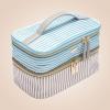 imageConair Travel Makeup Bag Large Toiletry and Cosmetic Bag Perfect Size for Use At Home or Travel Train Case Shape in Blue SuedeLike MaterialBlue and Tan