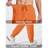 imageMAGCOMSEN Hiking Pants for Men Lightweight Athletic Pants Quick Dry with Zipper Pockets Running Track Workout PantsOrange
