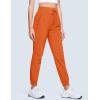 imageMAGCOMSEN Womens Hiking Pants Lightweight Quick Dry Waterproof Joggers with Pockets Athletic Travel Track CasualOrange